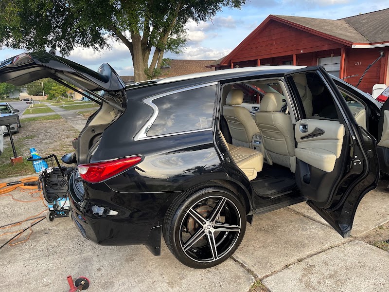 Black Infiniti SUV full detail - exterior shine and tan interior
