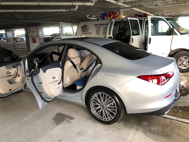 Silver sedan detail with AAA&JAY service van